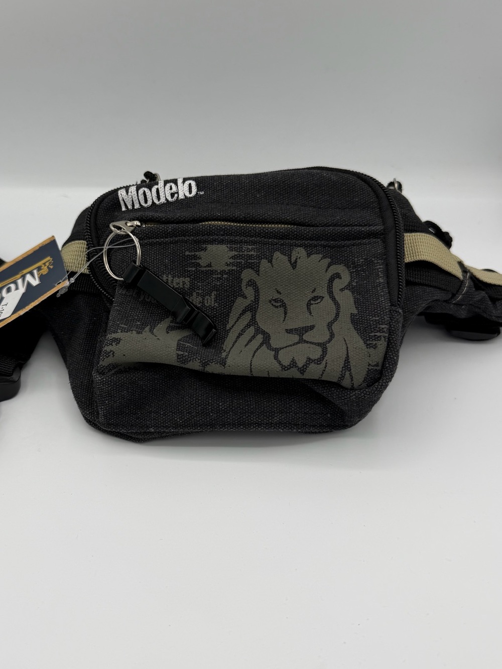 Model Black Canvas Waist Bag with Lion Graphic and Tan Strap Accents